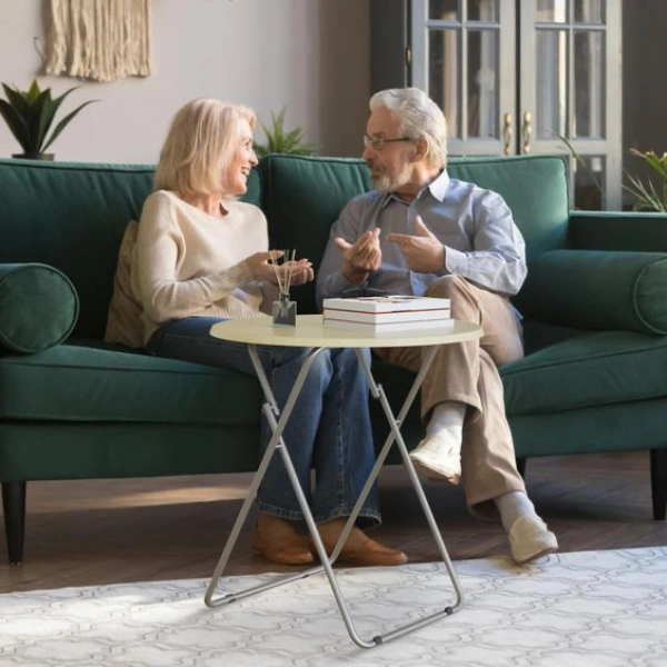 Two people sitting on the sofa and chatting